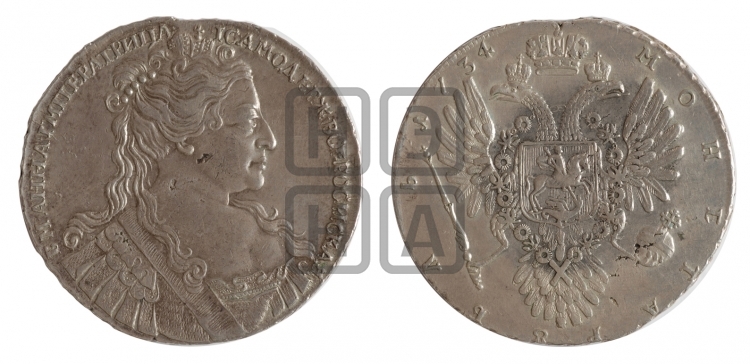 Рубль 1734 года (Большая голова, корона разделяет надпись, двойная складка над корсажем)