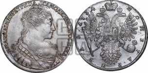 Рубль 1734 года (голова меньше, крест короны делит надпись, одинарная складка над корсажем)