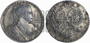 Рубль 1734 года (Большая голова, корона разделяет надпись, двойная складка над корсажем)