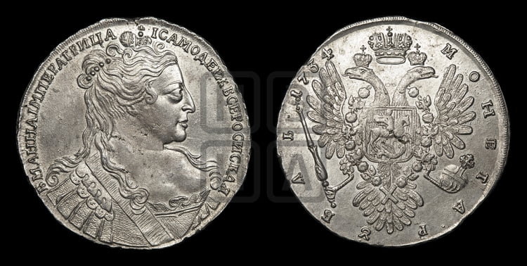 Рубль 1734 года (Большая голова, корона разделяет надпись, двойная складка над корсажем)